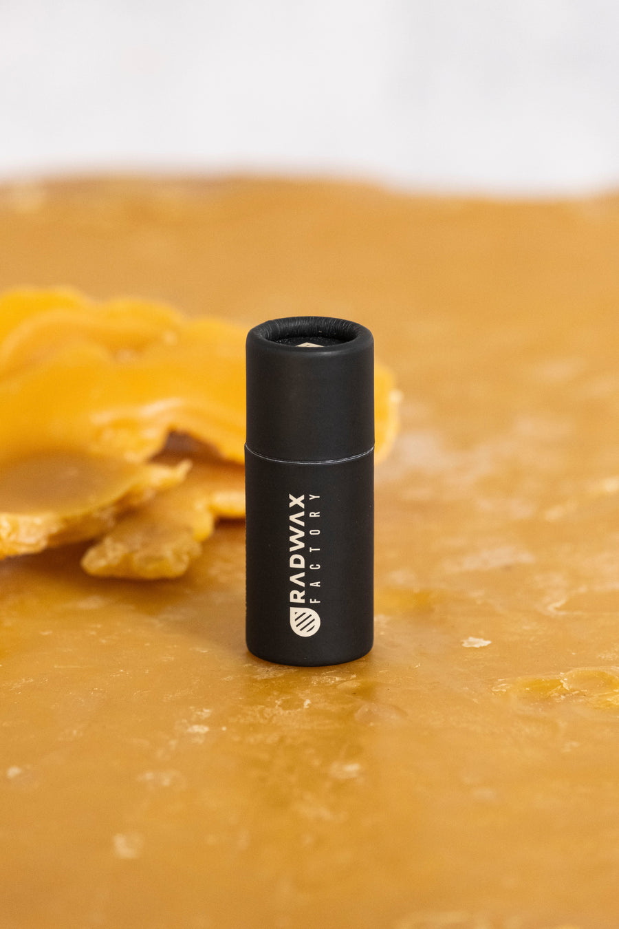 Rad Wax beeswax lip balm in a paperboard tube