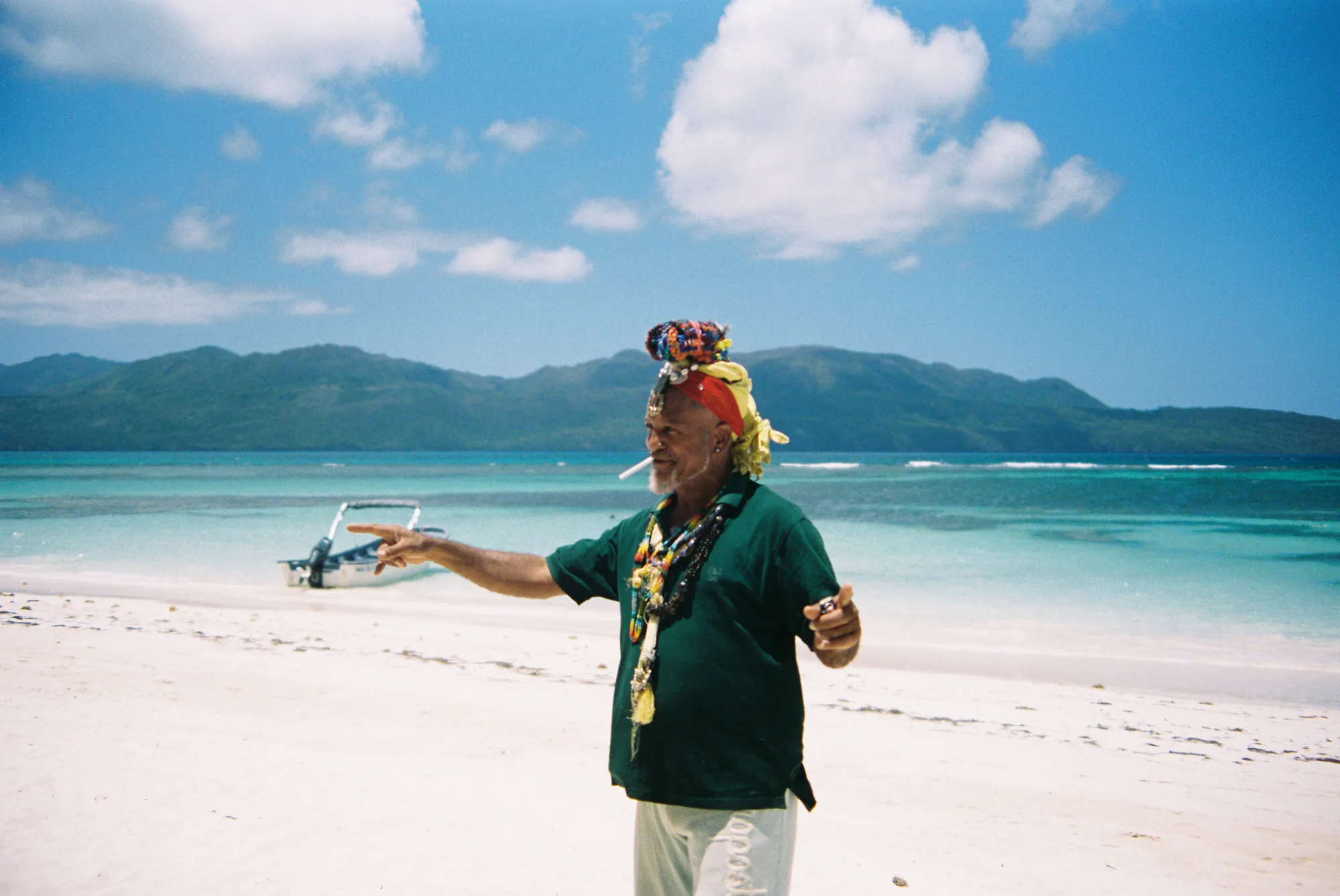 Older man on a Caribbean beach with a Full Moons cigarette