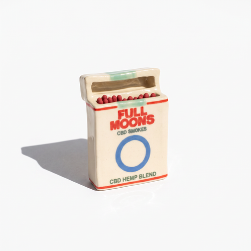 The Memento ceramic matchbox in Original, blue ring, standing upright with matches