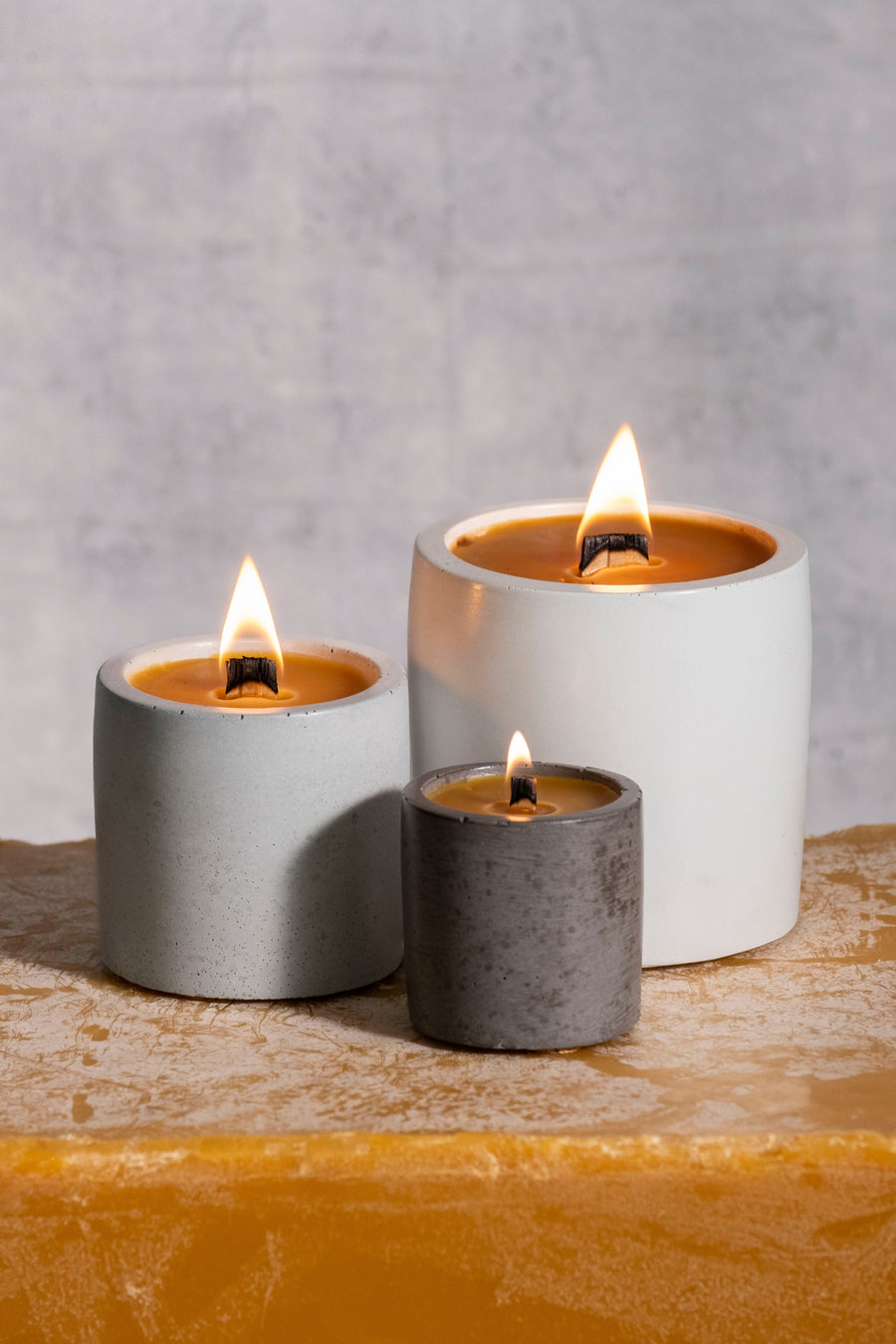 Rad Wax beeswax candles in cement